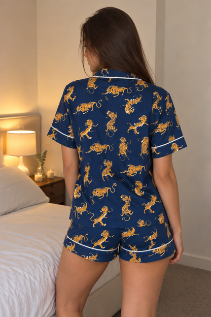 Close-up of the navy and golden tiger print and shirt pocket on the Golden Tiger Short Pyjama Set
