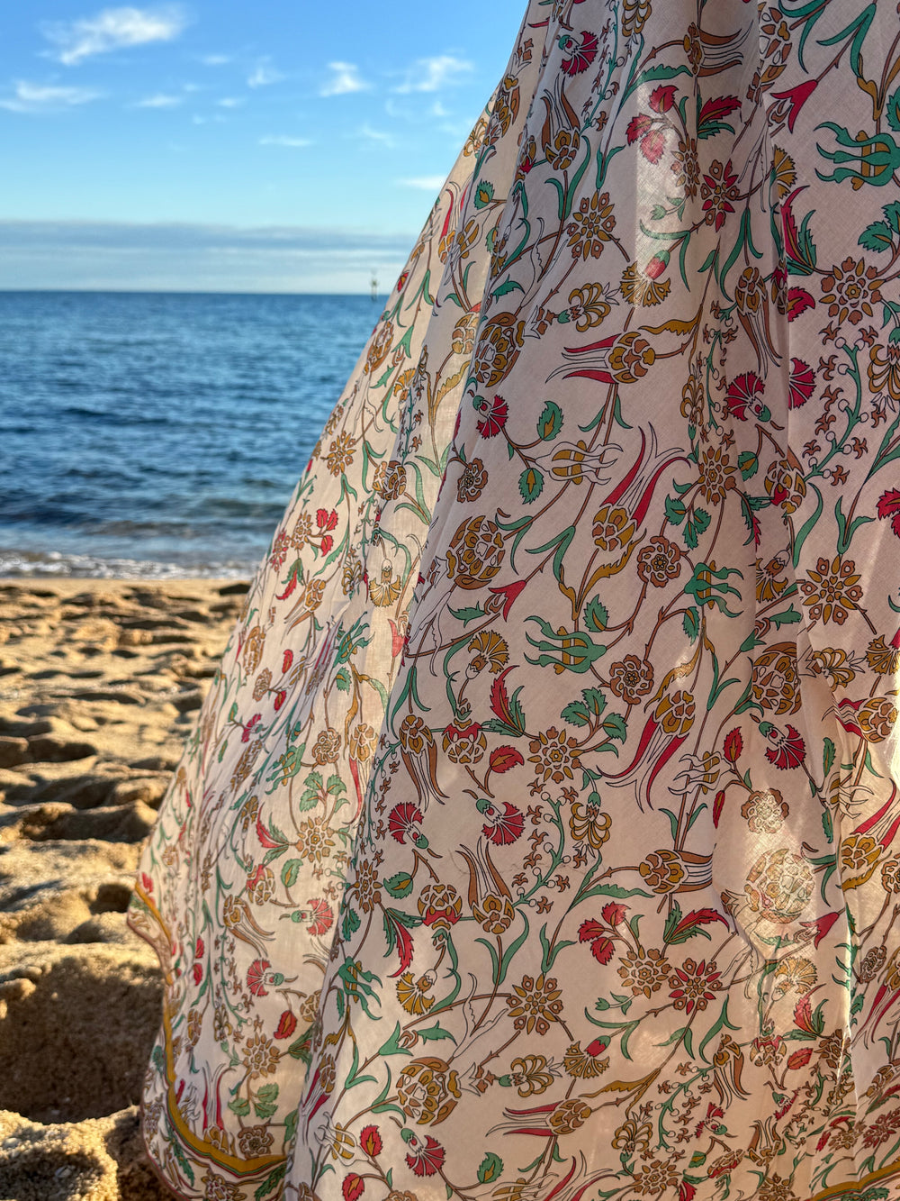 House of Neoma cotton dress photographed outdoors, showing drape and movement